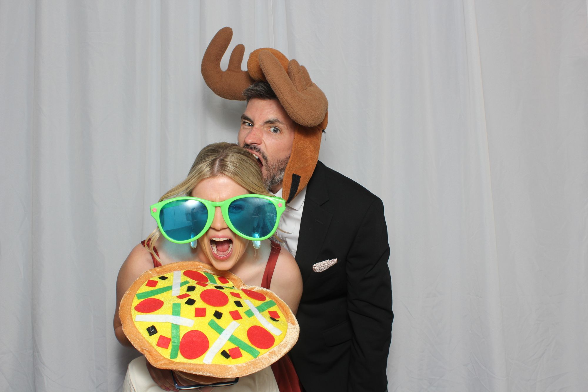 Friends having fun in the Oh Snap! photo booth